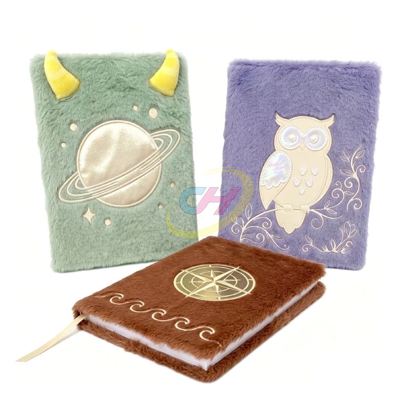 Brown compass plush notebook with purple owl and mint planet designs