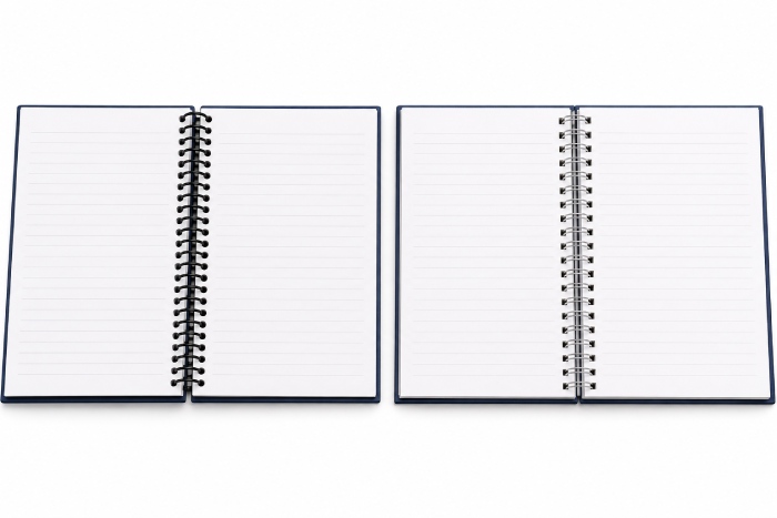 Plastic coil binding compared with double-loop Wire-O binding on hardcover notebooks