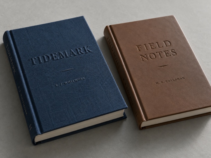 Raised embossing and recessed debossing on modern hardcover books