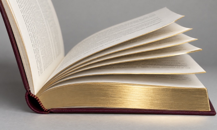 Gilded book pages separating cleanly after opening
