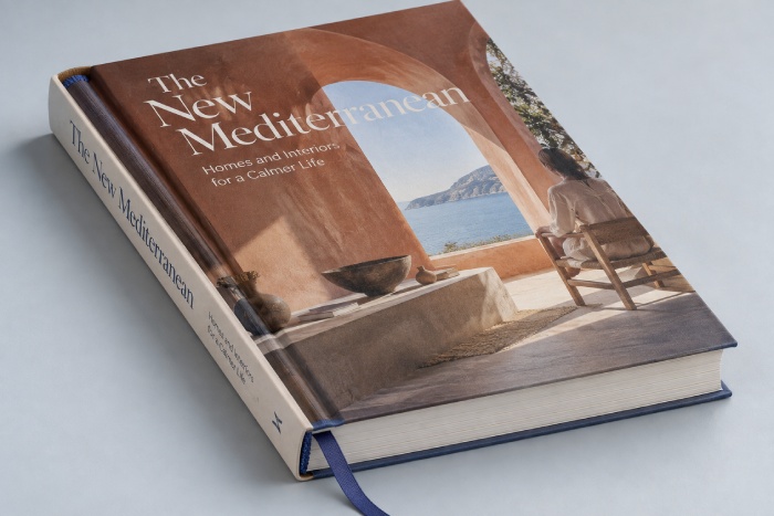 Modern case-bound hardcover book showing a woven headband and a ribbon bookmark extending below the page block