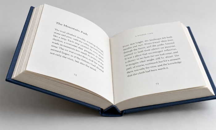 Hardcover joint and wrapped book board edge in an open casebound book